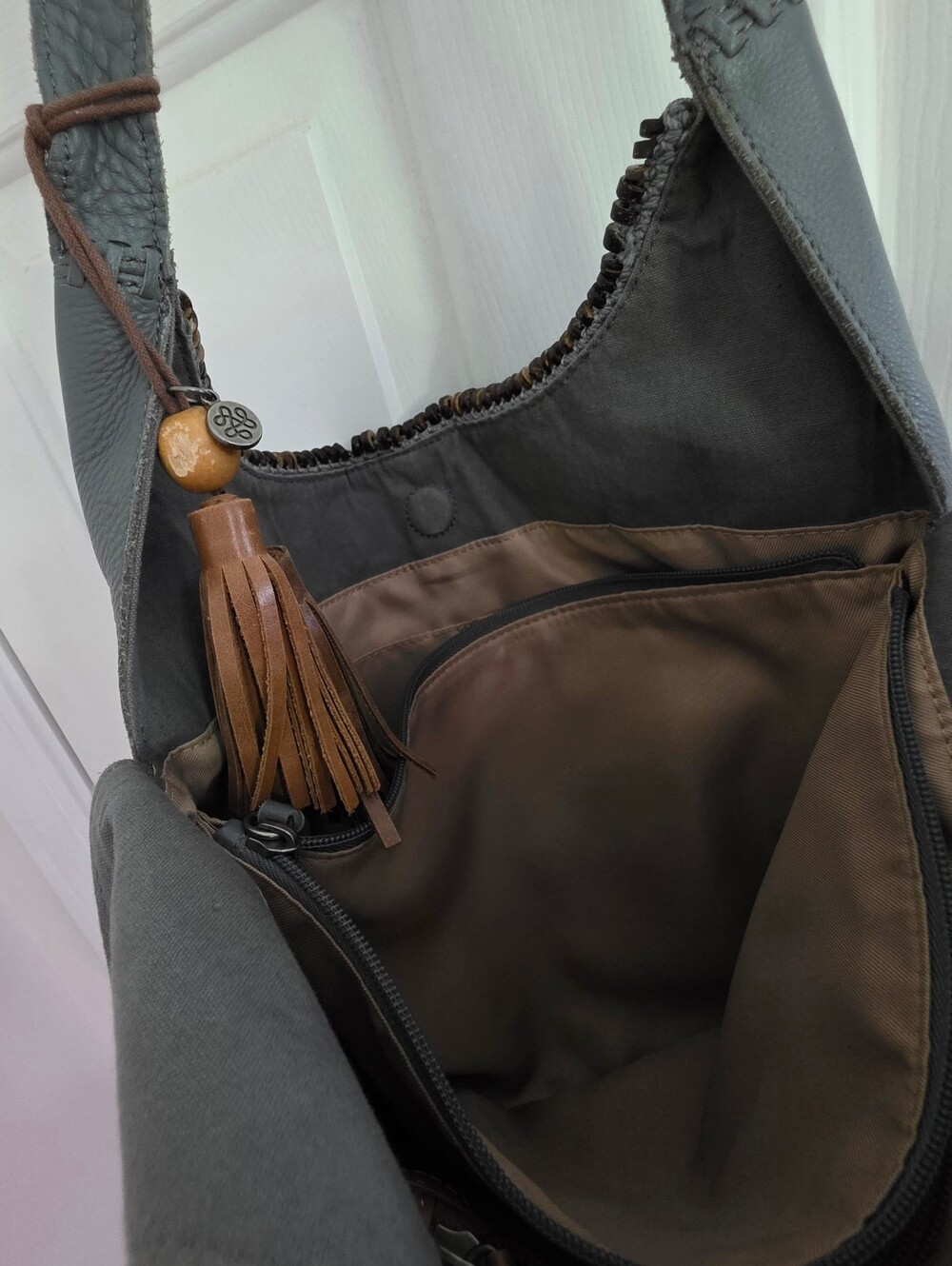 The Sak Gray Leather Huntley Hobo Bag with Brown Tassel - Picture 8 of 10